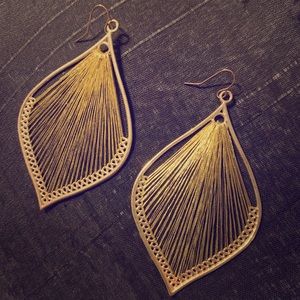 Gold harp earrings.